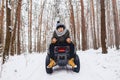 A boy is standing near a quad bike in the middle of the forest Royalty Free Stock Photo