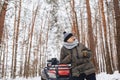 A boy is standing near a quad bike in the middle of the forest Royalty Free Stock Photo