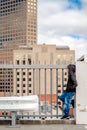 Boy standing on top of the roof Royalty Free Stock Photo