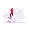 Boy standing on top of a tower of books, excited to return to school. Education and reading concepts. Royalty Free Stock Photo