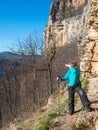 A boy stands near the a rock Royalty Free Stock Photo