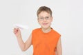 Boy starts paper plane