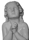 Boy statue pray to God with hands held together. Beautiful old stone statue of praying child isolated on white Royalty Free Stock Photo