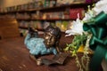 boy statue reading book at library