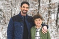 boy and Stepfather on forest in winter season Royalty Free Stock Photo