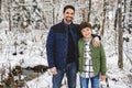 boy and Stepfather on forest in winter season Royalty Free Stock Photo