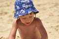 Boy sticky sand castles. The sea and beach in an exotic country