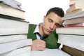 Boy student sleeping over stack books over desk Royalty Free Stock Photo
