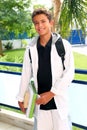 Boy student teenager backpack holding books