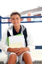 Boy student teenager backpack holding books