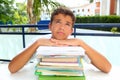 Boy student teenager bored thinking with books