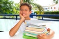 Boy student teenager happy thinking with books