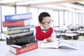 Boy study literature books at library Royalty Free Stock Photo