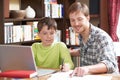Boy Studying With Home Tutor Royalty Free Stock Photo
