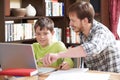 Boy Studying With Home Tutor Royalty Free Stock Photo