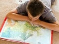 Boy studying a map Royalty Free Stock Photo