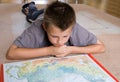 Boy studying a map Royalty Free Stock Photo