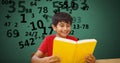 Boy studying while numbers flying in background Royalty Free Stock Photo