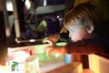 Boy studying the refraction of light Royalty Free Stock Photo