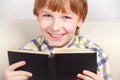 Boy studying the scriptures.