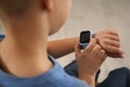 Boy with stylish smart watch, closeup view