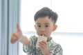 The boy is sucking milk from the milk box. He likes milk box so much Royalty Free Stock Photo