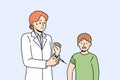 Boy suffers vaccine phobia and is crying standing near woman doctor holding syringe with injection Royalty Free Stock Photo