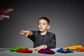 Boy in suit launching paper plane Royalty Free Stock Photo