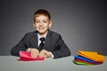 Boy in suit making red paper plane Royalty Free Stock Photo