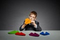 Boy in suit making yellow paper plane Royalty Free Stock Photo