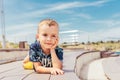 Boy in the summer against the sky in a beautiful T-shirt with palm trees Royalty Free Stock Photo