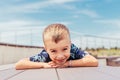 Boy in the summer against the sky in a beautiful T-shirt with palm trees Royalty Free Stock Photo