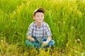 Boy on summer nature with dandelions Royalty Free Stock Photo