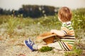 Boy at summer sunset ground