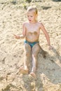 Boy sunbathes on the sand Royalty Free Stock Photo