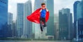 Boy in super hero cape and mask showing thumbs up Royalty Free Stock Photo