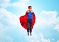 Boy in super hero cape and mask showing thumbs up Royalty Free Stock Photo