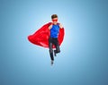 Boy in super hero cape and mask showing thumbs up Royalty Free Stock Photo