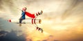 Boy in superhero costume fly on a rocket and show super abilities. Royalty Free Stock Photo