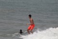 The boy surfer in Lagos popular beach, Tarkwa bay, Lagos Nigeria Royalty Free Stock Photo