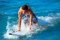 Boy surfer surfing waves on the beach