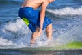 Boy surfer surfing waves on the beach Royalty Free Stock Photo