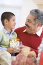 Boy Surprising Father With Christmas Present Royalty Free Stock Photo