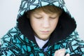 Boy in Sweatshirt Looking Down Royalty Free Stock Photo