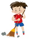 Boy sweeping floor with broom