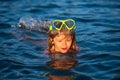 Boy swim on the beach on summer holidays. Happy kids swimming in the water. Little boy swimming in ocean or sea. Royalty Free Stock Photo