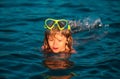 Boy swim on the beach on summer holidays. Happy kids swimming in the water. Little boy swimming in ocean or sea. Royalty Free Stock Photo