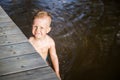 Boy swim near footbridge