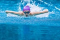 Boy swimmer swimming Butterfly stroke in a nice clear swimming p Royalty Free Stock Photo