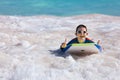 Boy swimming on boogie board Royalty Free Stock Photo